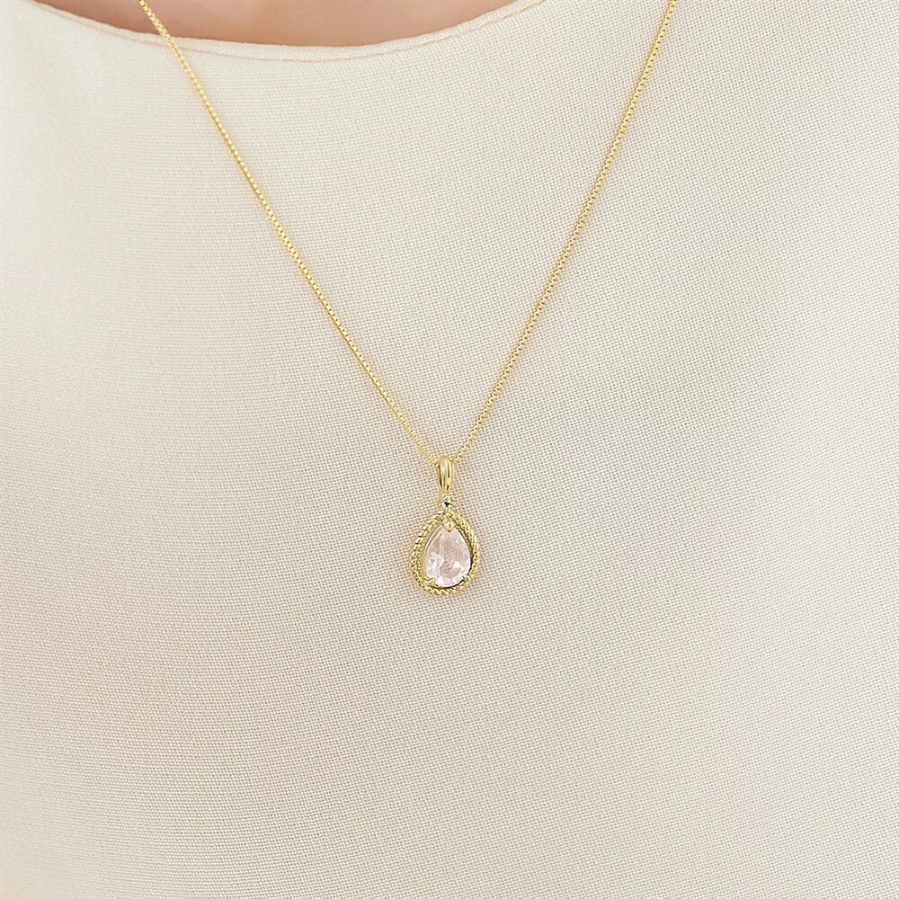 途切れぬ愛の絆「縄目模様」 K10イエローゴールドローズクォーツホワイトトパーズリングイメージ